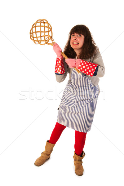 Housewife with carpet beater Stock photo © ivonnewierink