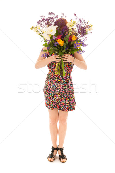 Red haired girl standing with bouquet flowers isolated over whit Stock photo © ivonnewierink