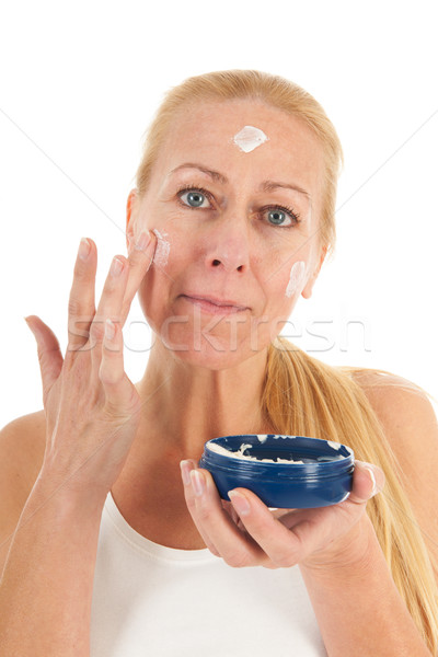 Woman of mature age with cream Stock photo © ivonnewierink