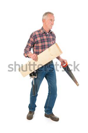 Worker with saw and timber Stock photo © ivonnewierink