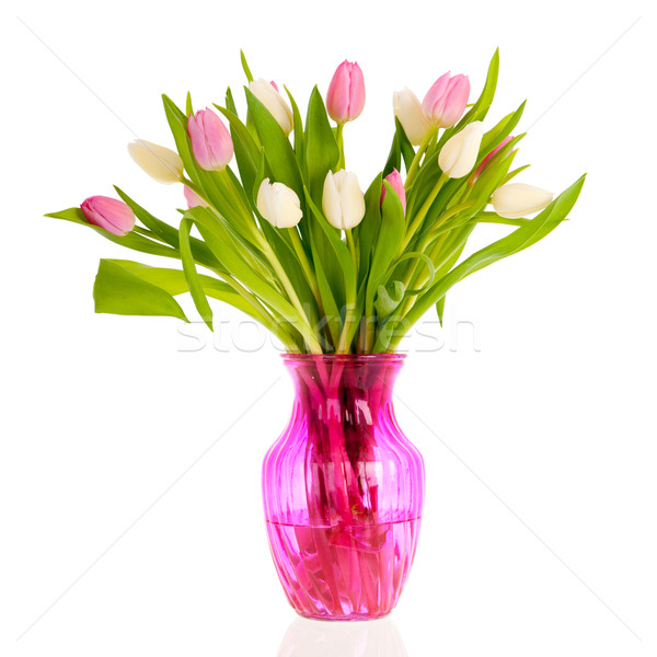 Pink and white tulips in glass vase Stock photo © ivonnewierink