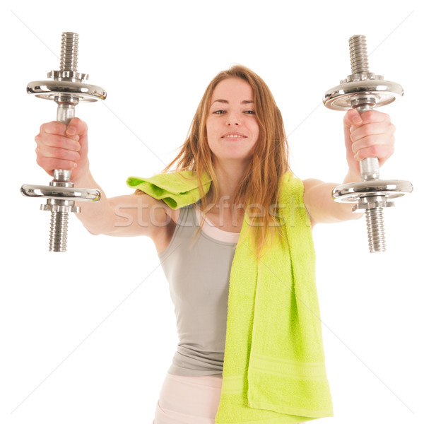Woman exercising with heavy dumbells Stock photo © ivonnewierink
