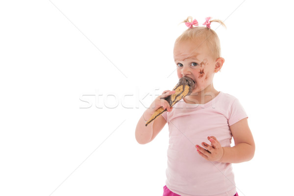 Stock photo: Toddler girl eating ice cream