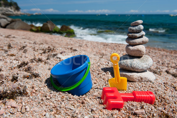 Сток-фото: пляж · камней · игрушками · пейзаж · пластиковых