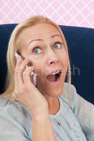 Woman on the phone getting amazing news Stock photo © ivonnewierink