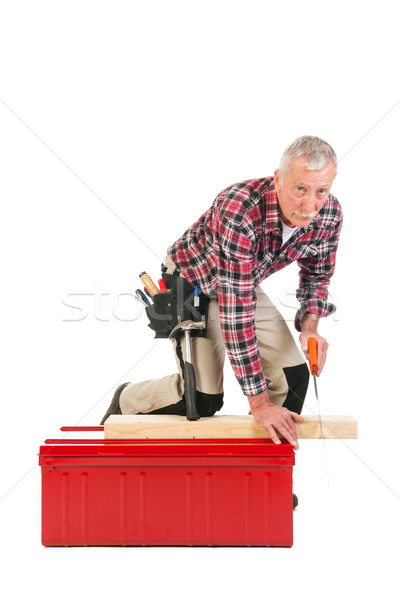 Senior manual worker sawing Stock photo © ivonnewierink