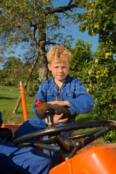 Farm Boy with tractor Stock photo © ivonnewierink