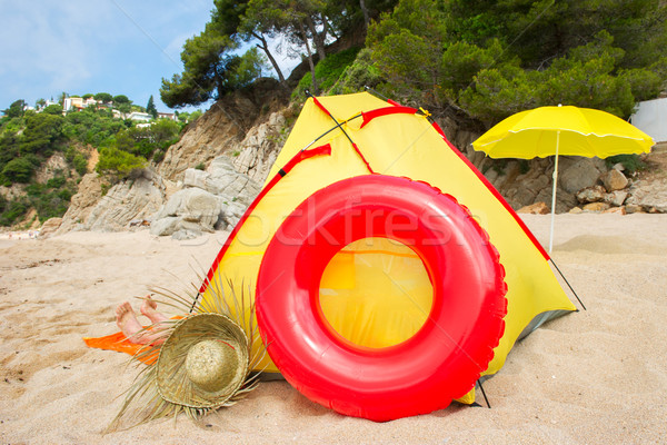 Beach tent with toys and feet Stock photo © ivonnewierink