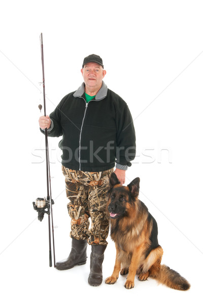 Fisherman with fishing rod and dog Stock photo © ivonnewierink