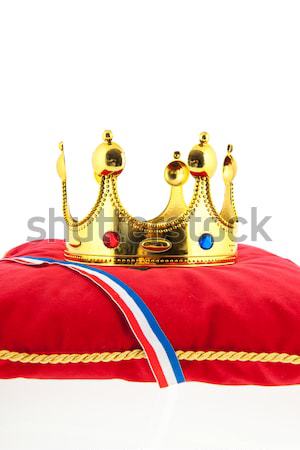 Golden crown on velvet pillow with Dutch flag Stock photo © ivonnewierink