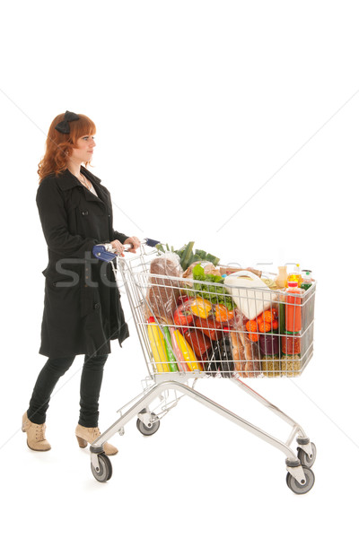 Woman with Shopping cart full dairy grocery Stock photo © ivonnewierink