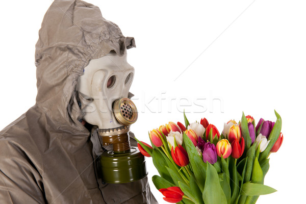 Homem máscara de gás proteção terno flores fundo Foto stock © ivonnewierink