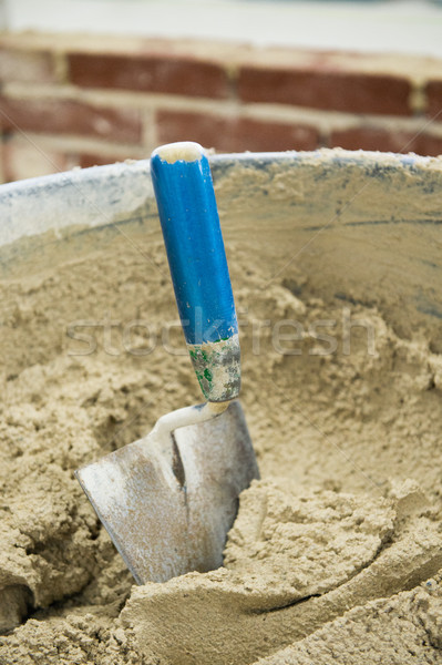 Stock photo: Trowel and mortar tub