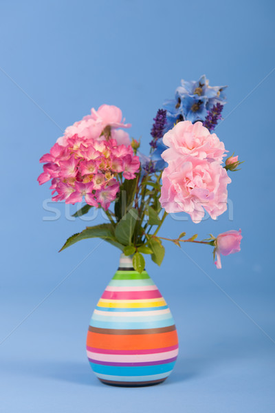 Mixed bouquet flowers on blue background Stock photo © ivonnewierink