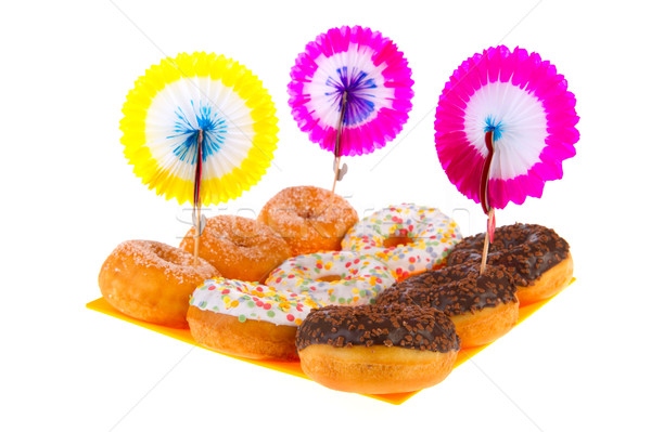 Stock photo: Birthday donuts with colorful glaze