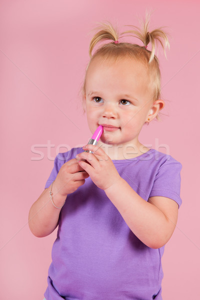 Toddler girl in pink with lipstick Stock photo © ivonnewierink