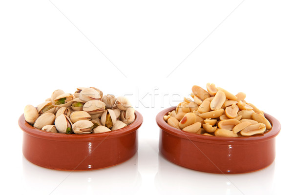 Pistachio and peanuts Stock photo © ivonnewierink