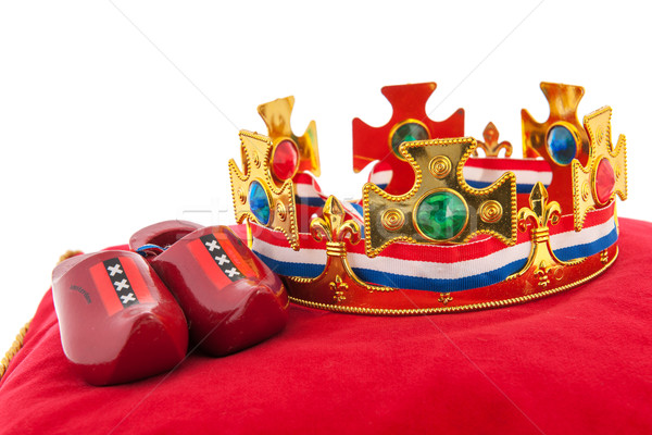 Golden crown on velvet pillow with Dutch flag Stock photo © ivonnewierink
