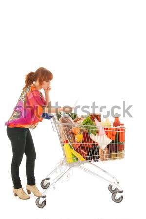 Woman with Shopping cart full dairy grocery Stock photo © ivonnewierink