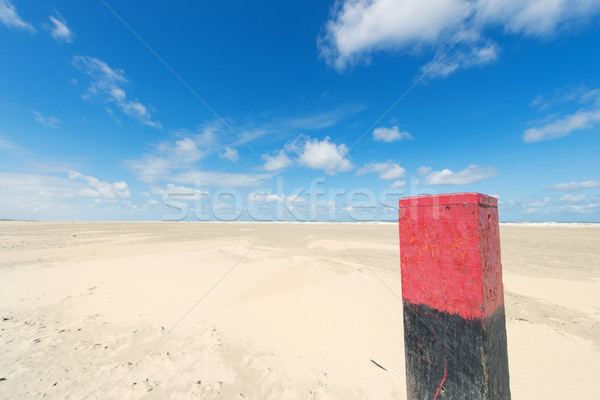 Wooden pole at the beach Stock photo © ivonnewierink