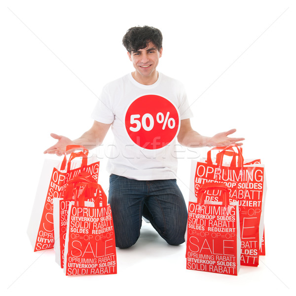 Heureux vente jeune homme beaucoup sacs papier [[stock_photo]] © ivonnewierink