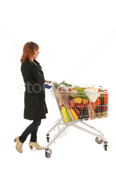 Woman with Shopping cart full dairy grocery Stock photo © ivonnewierink