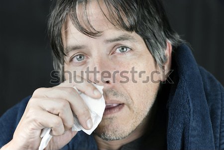 Man Covers Mouth After Smelling Shoe Stock photo © jackethead