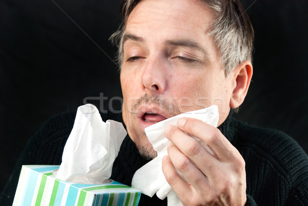 Férfi tüsszentés közelkép tart papírzsebkendő doboz Stock fotó © jackethead