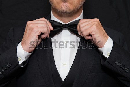 úriember fekete nyakkendő közelkép visel kezek Stock fotó © jackethead