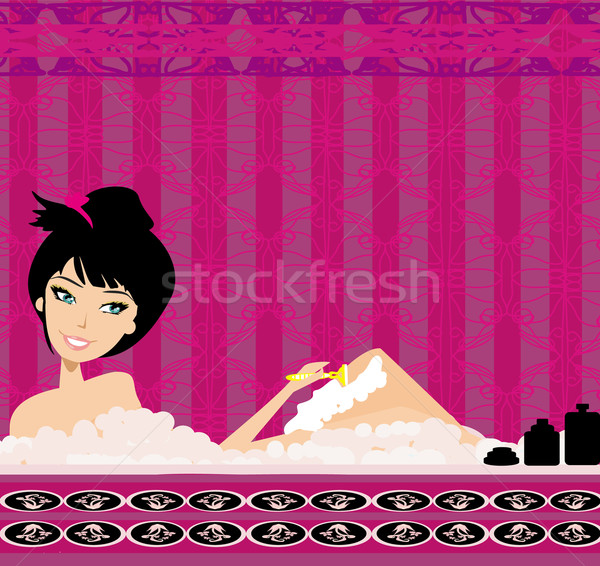 Young woman shaving legs in bath.  Stock photo © JackyBrown