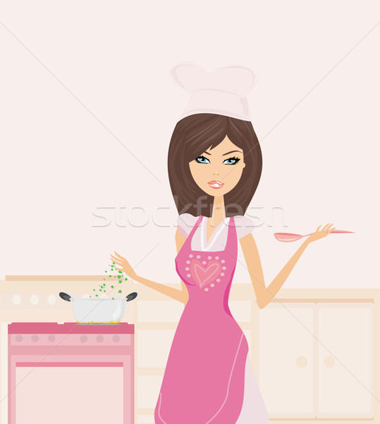 Beautiful lady cooking soup in the kitchen Stock photo © JackyBrown