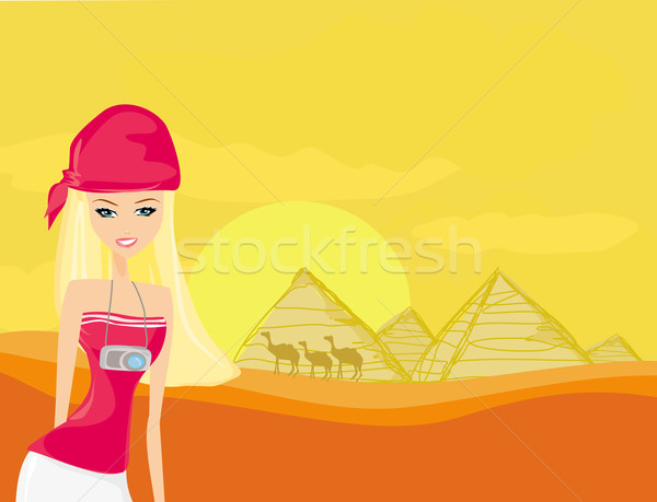 Women on background the pyramids in Giza built for the pharaoh.  Stock photo © JackyBrown