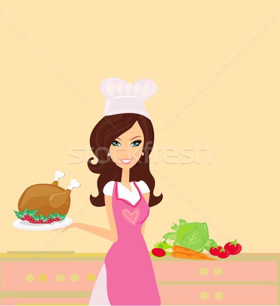 Beautiful lady cooking chicken in the kitchen Stock photo © JackyBrown