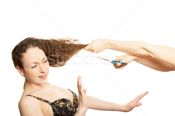Woman in bra resists funny hairstyle on white Stock photo © jagston