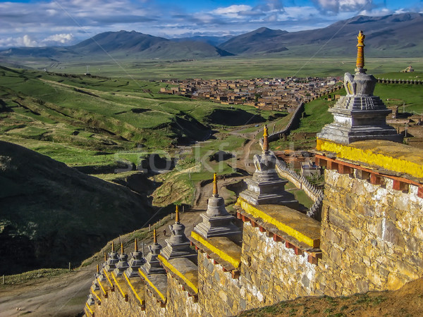 Wall with Stupas and Distant town Stock photo © jameswheeler