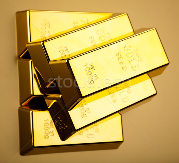 Gold bars and coins, ambient financial concept Stock photo © JanPietruszka