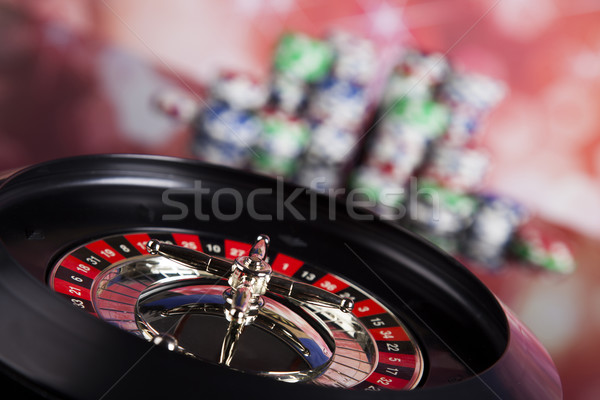 Poker Chips on a gaming with casino roulette Stock photo © JanPietruszka