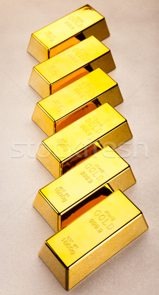 Coins and gold bars, ambient financial concept Stock photo © JanPietruszka