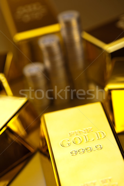Stock photo: Gold bars and coins, ambient financial concept