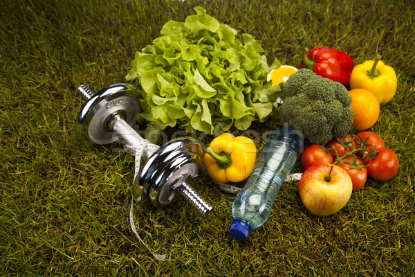 Vitamin and Fitness diet, dumbell in green grass Stock photo © JanPietruszka
