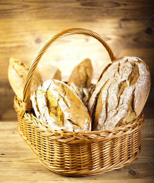 Baked bread in basket, natural colorful tone Stock photo © JanPietruszka
