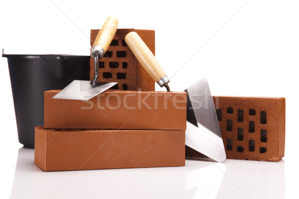 Building background, trowel and bricks Stock photo © JanPietruszka