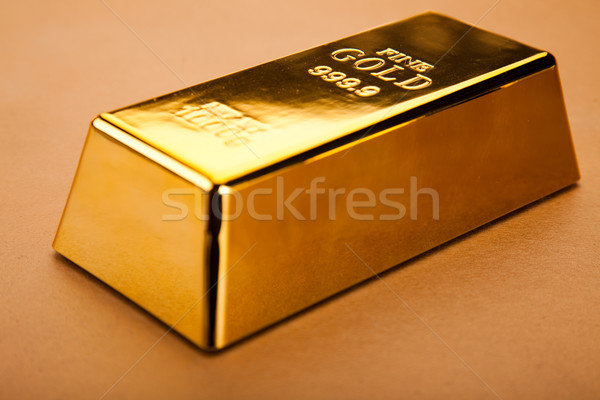 Coins and gold bars, ambient financial concept Stock photo © JanPietruszka