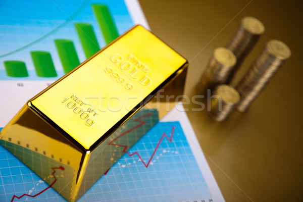 Stock photo: Gold bars with a linear graph, ambient financial concept