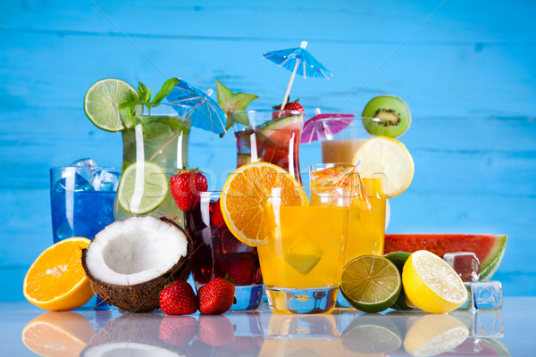 Stock photo: Fruit cocktails on the beach 