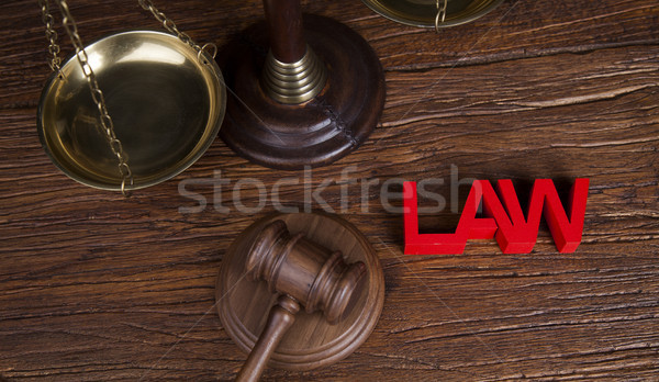 Stock photo: Law theme, mallet of the judge, wooden desk background