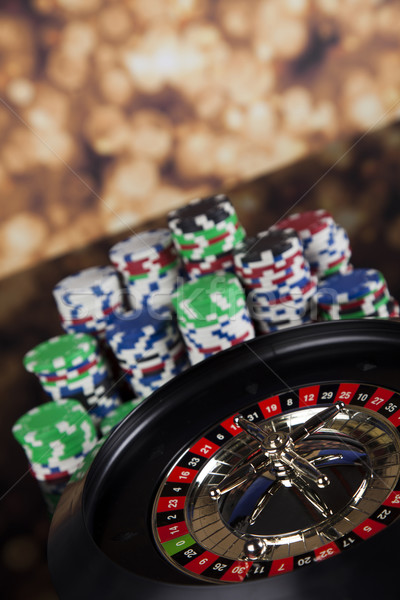 Poker Chips on a gaming with casino roulette Stock photo © JanPietruszka