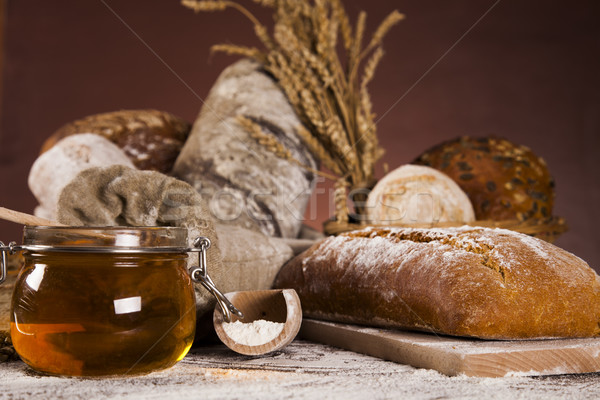 Fresh bread and wheat on the wooden Stock photo © JanPietruszka