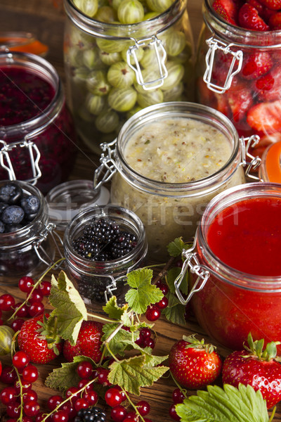 Stock photo: Glass of mixed berry jam with strawberries, bilberries, red curr