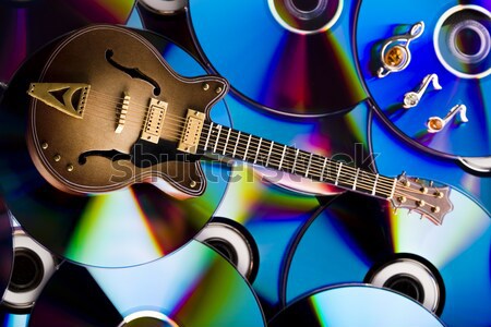 Stock photo: Discs and guitar, bright colorful vivid theme